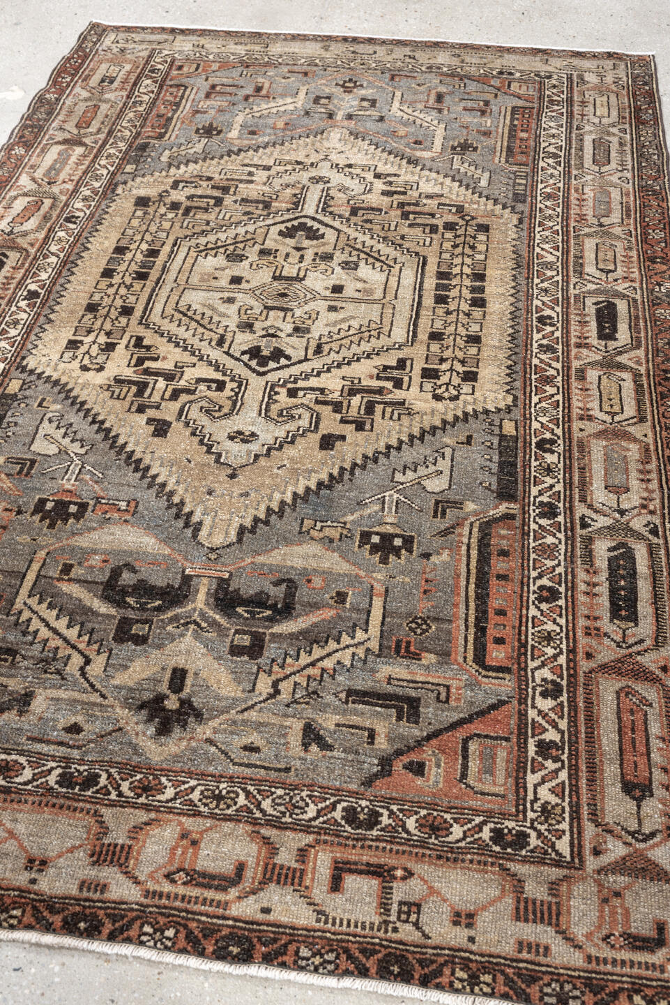 4' x 6' one-of-a-kind handmade antique Hamadan rug. Color palette: ivory, slate blue, charcoal, terracotta, taupe, ebony