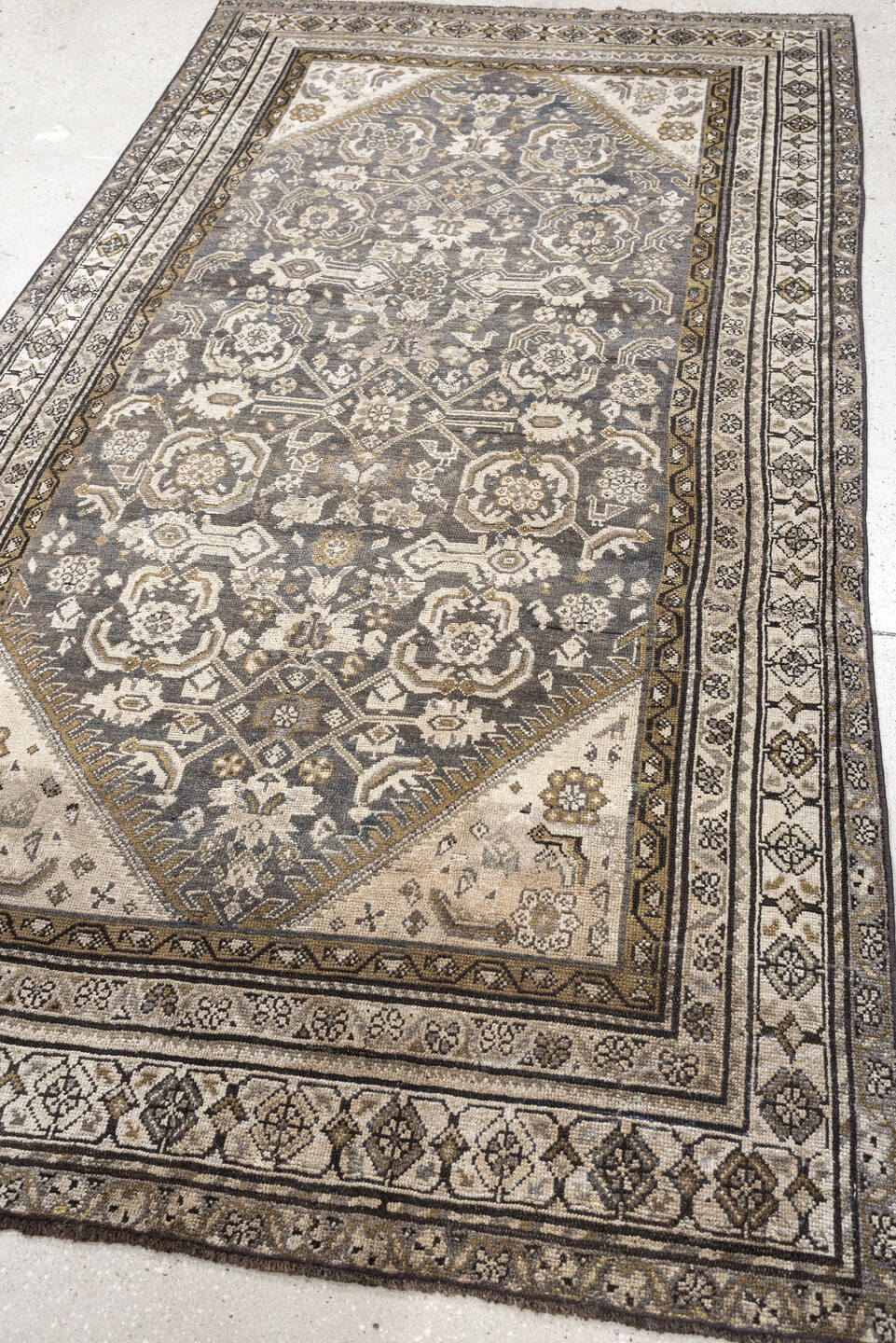 4' x 7' one-of-a-kind handmade antique Malayer rug. Color palette: charcoal, ivory, taupe, ochre, camel, ebony, slate, black
