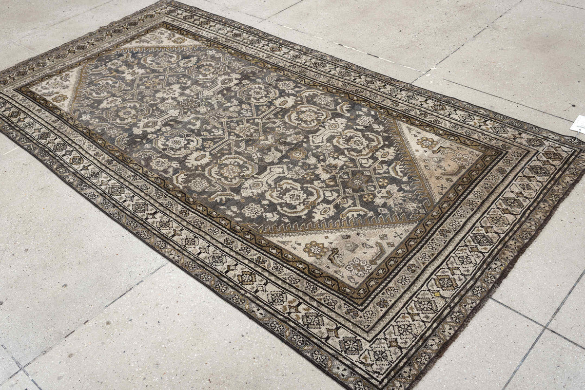 4' x 7' one-of-a-kind handmade antique Malayer rug. Color palette: charcoal, ivory, taupe, ochre, camel, ebony, slate, black