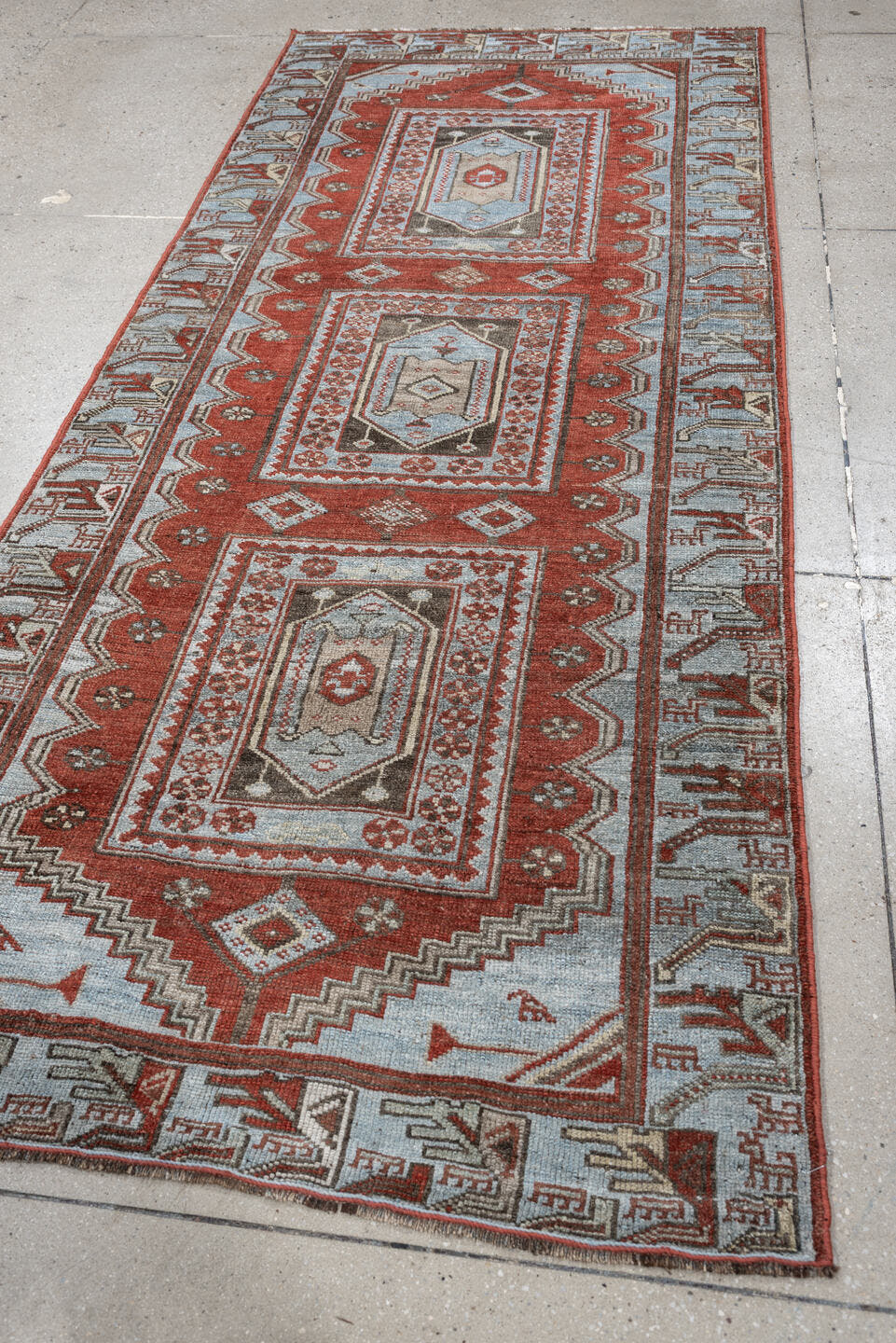 3' x 9' one-of-a-kind handmade antique Kurd runner rug. Color palette: terracotta, blue gray, ivory, charcoal, rust, taupe