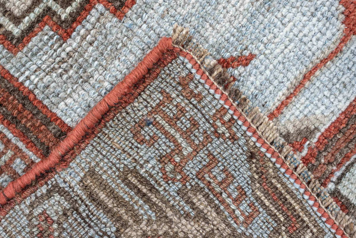 3' x 9' one-of-a-kind handmade antique Kurd runner rug. Color palette: terracotta, blue gray, ivory, charcoal, rust, taupe