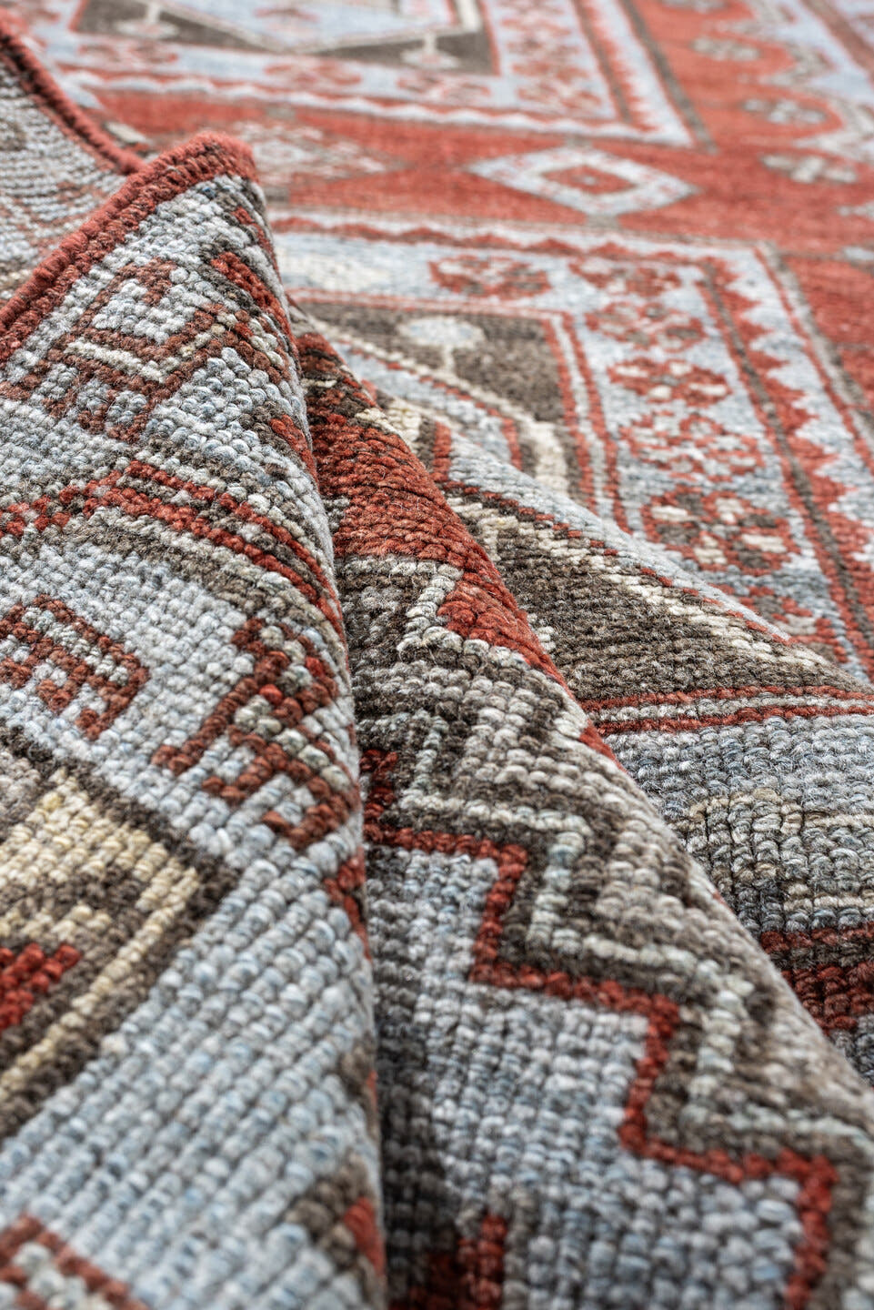 3' x 9' one-of-a-kind handmade antique Kurd runner rug. Color palette: terracotta, blue gray, ivory, charcoal, rust, taupe