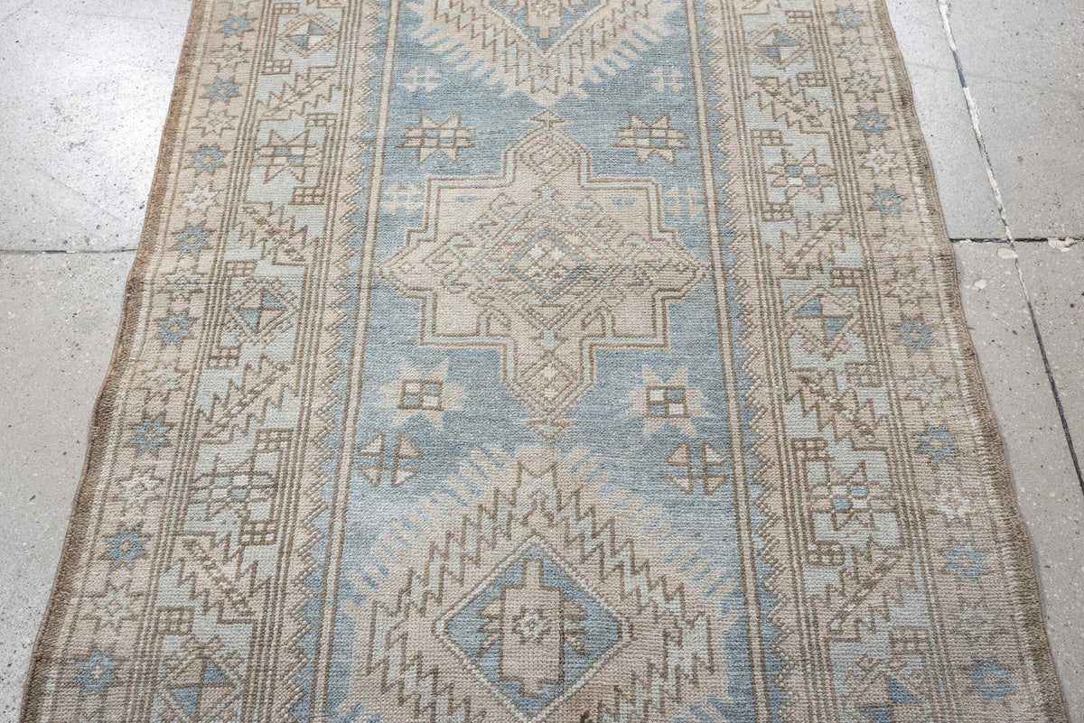 3' x 11' one-of-a-kind handmade antique Heriz runner rug. Color palette: sky blue, ivory, taupe, beige, camel, slate, brown