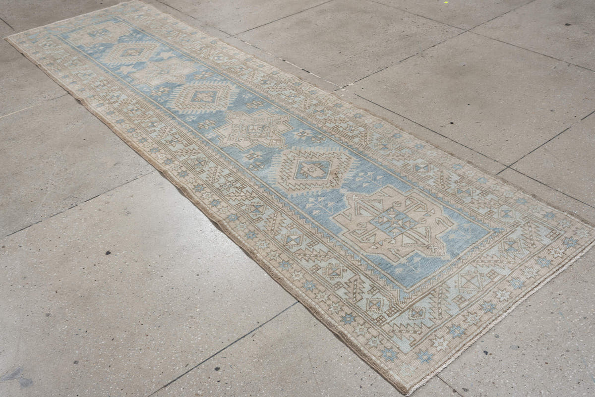 3' x 11' one-of-a-kind handmade antique Heriz runner rug. Color palette: sky blue, ivory, taupe, beige, camel, slate, brown