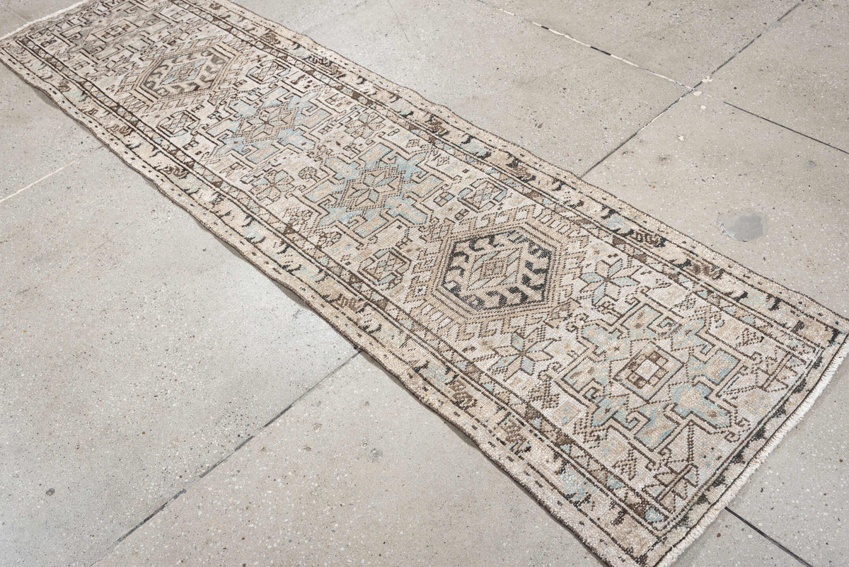 2' x 7' one-of-a-kind handmade antique Karaje runner rug. Color palette: ivory, pale blue, taupe, brown, charcoal, beige