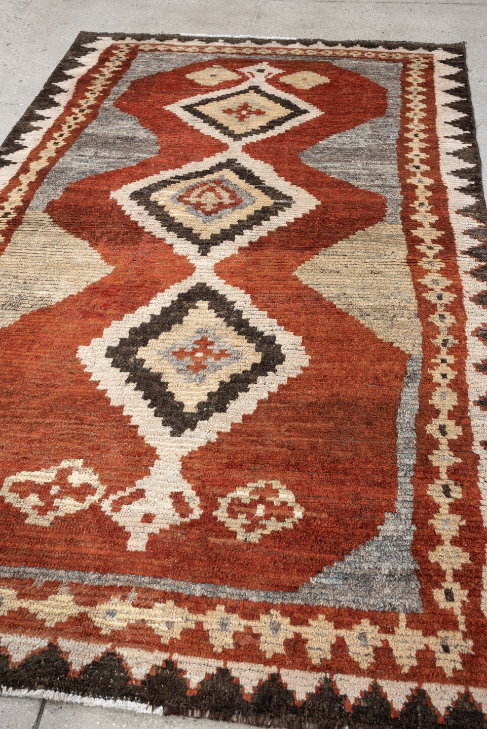 4' x 7' one-of-a-kind handmade antique Gabbe rug. Color palette: rust, ivory, gray, dark brown, cream, charcoal, terracotta
