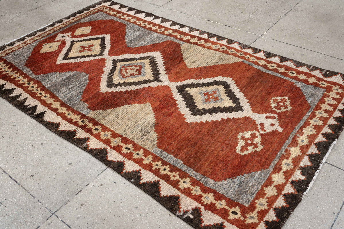4' x 7' one-of-a-kind handmade antique Gabbe rug. Color palette: rust, ivory, gray, dark brown, cream, charcoal, terracotta