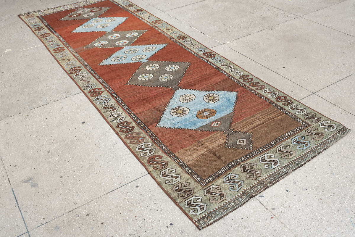 3' x 10' one-of-a-kind handmade antique Kurd runner rug. Color palette: rust, terra cotta, pale blue, taupe, ivory, sage