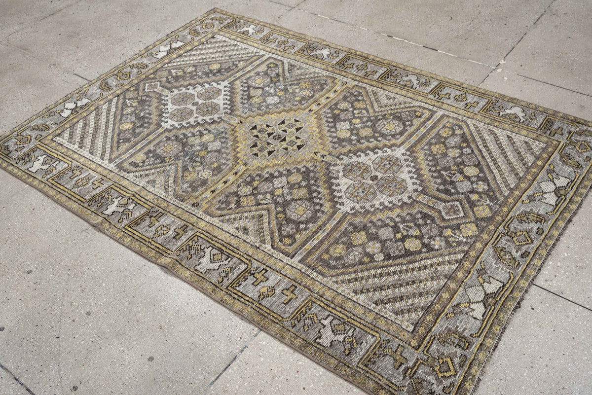 4' x 5' one-of-a-kind handmade antique Shiraz small size rug. Color palette: taupe, charcoal, ivory, soft gold, gray, brown