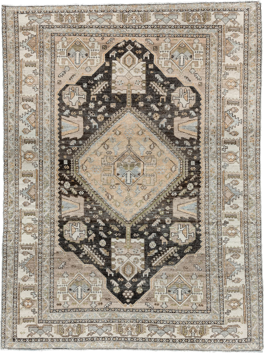 4' x 6' one-of-a-kind handmade antique Shiraz rug. Color palette: ivory, charcoal, camel, taupe, pale blue, olive, sand