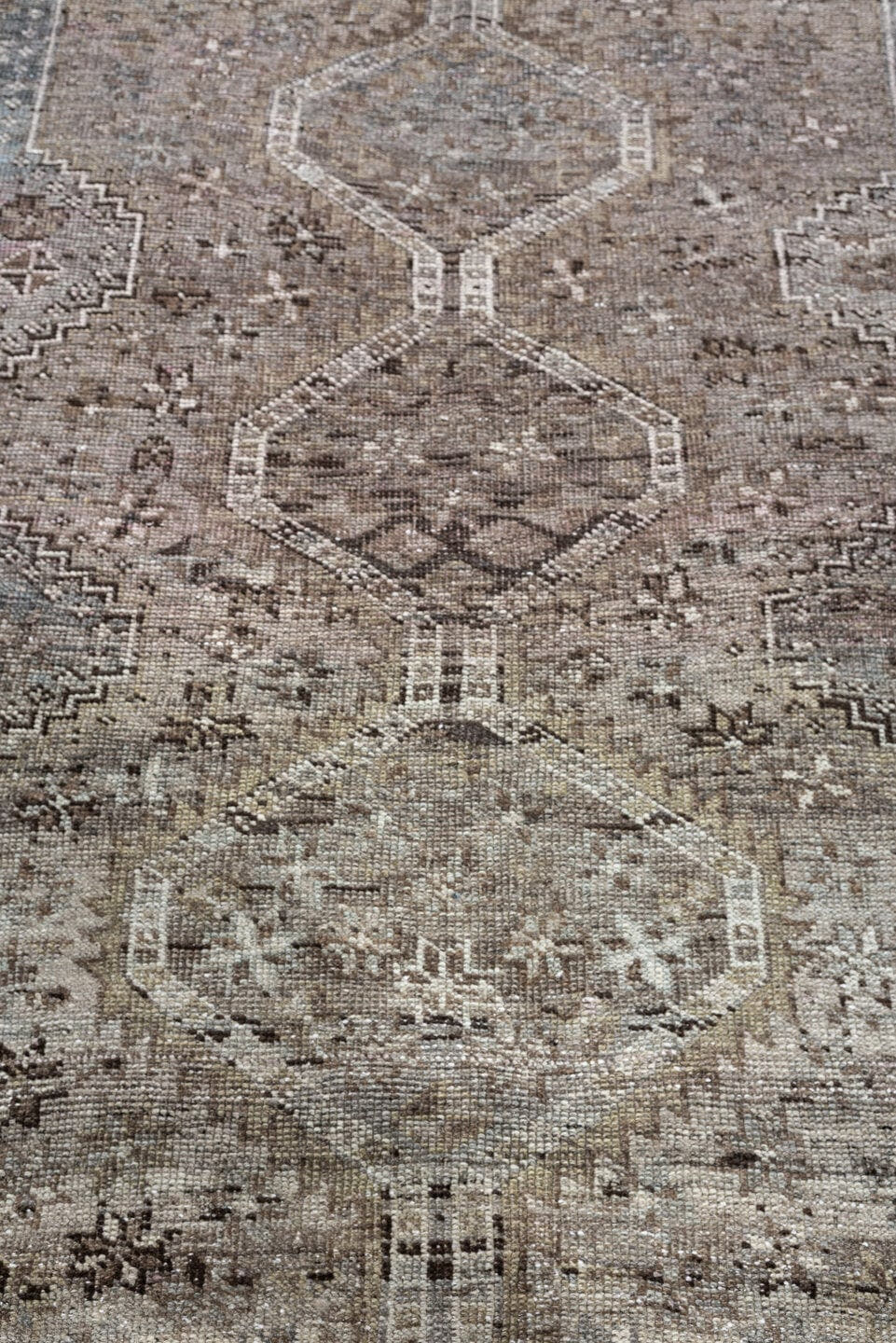 5' x 6' one-of-a-kind handmade antique Shiraz rug. Color palette: taupe, ivory, charcoal, blue gray, brown, slate, beige