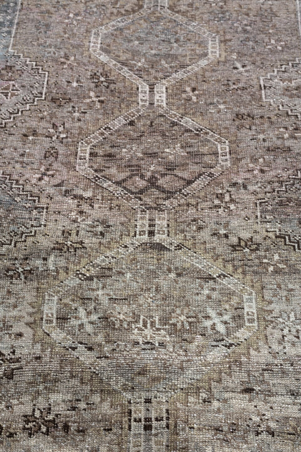 5' x 6' one-of-a-kind handmade antique Shiraz rug. Color palette: taupe, ivory, charcoal, blue gray, brown, slate, beige