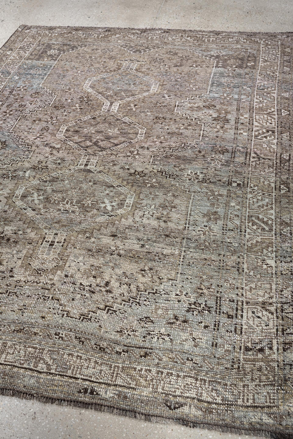 5' x 6' one-of-a-kind handmade antique Shiraz rug. Color palette: taupe, ivory, charcoal, blue gray, brown, slate, beige