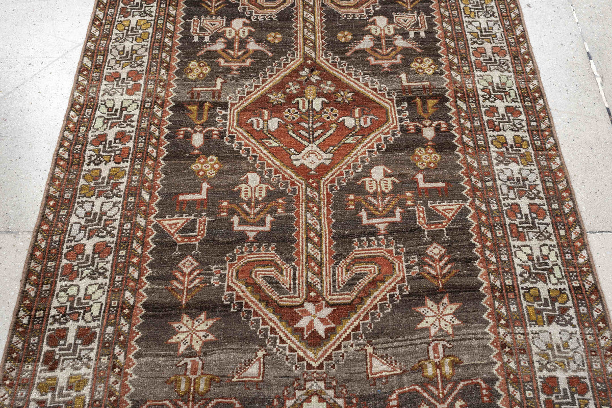 3' x 12' one-of-a-kind handmade antique Shiraz runner rug. Color palette: dark brown, ivory, rust, terra cotta, charcoal