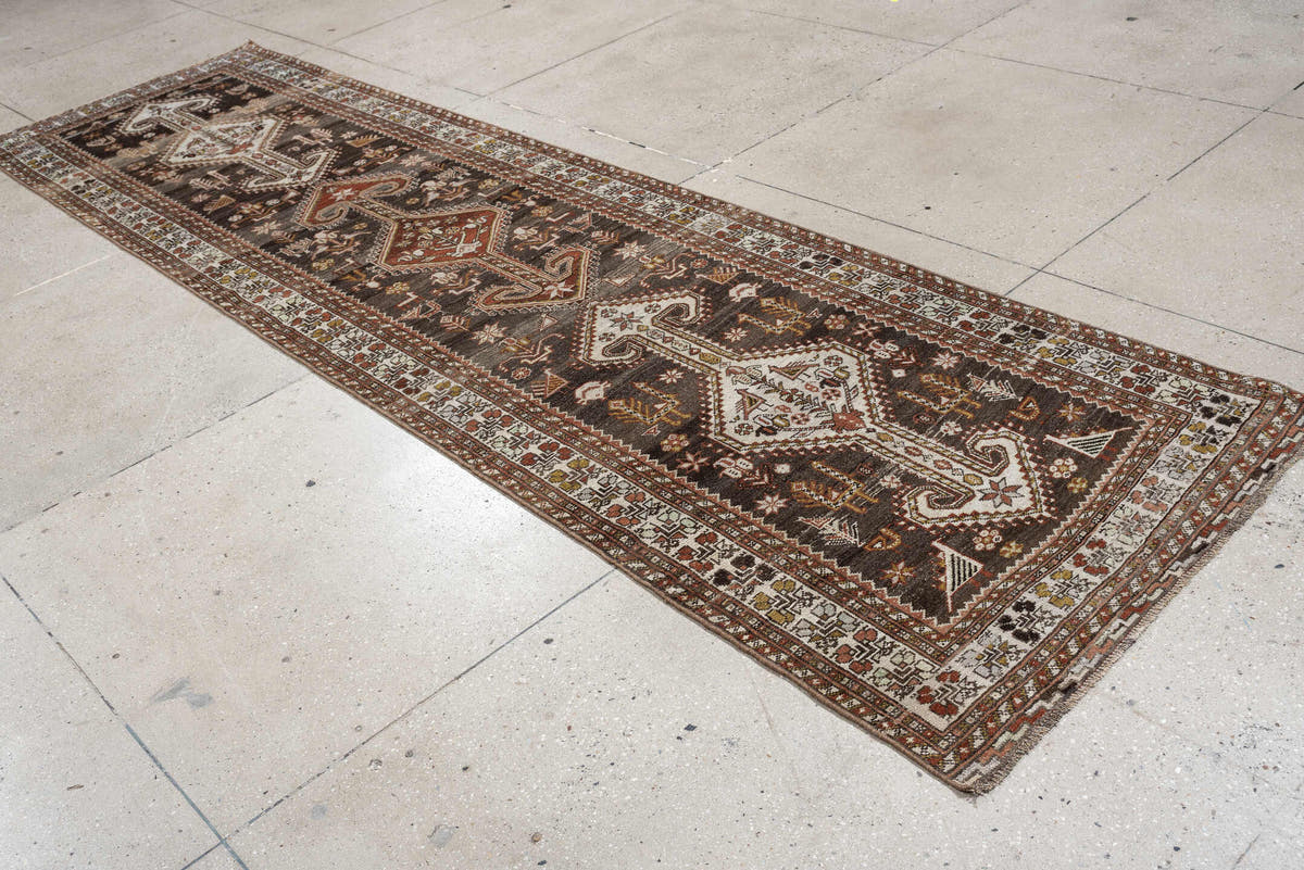 3' x 12' one-of-a-kind handmade antique Shiraz runner rug. Color palette: dark brown, ivory, rust, terra cotta, charcoal