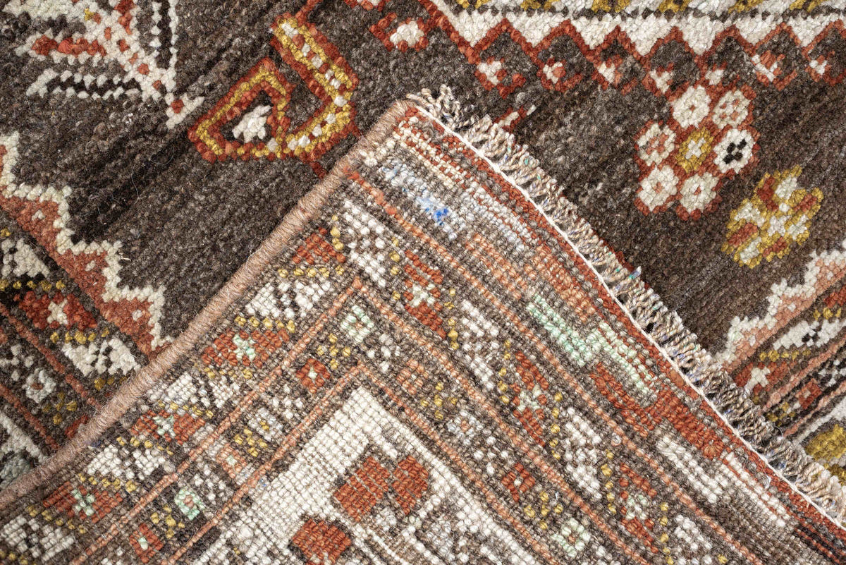 3' x 12' one-of-a-kind handmade antique Shiraz runner rug. Color palette: dark brown, ivory, rust, terra cotta, charcoal