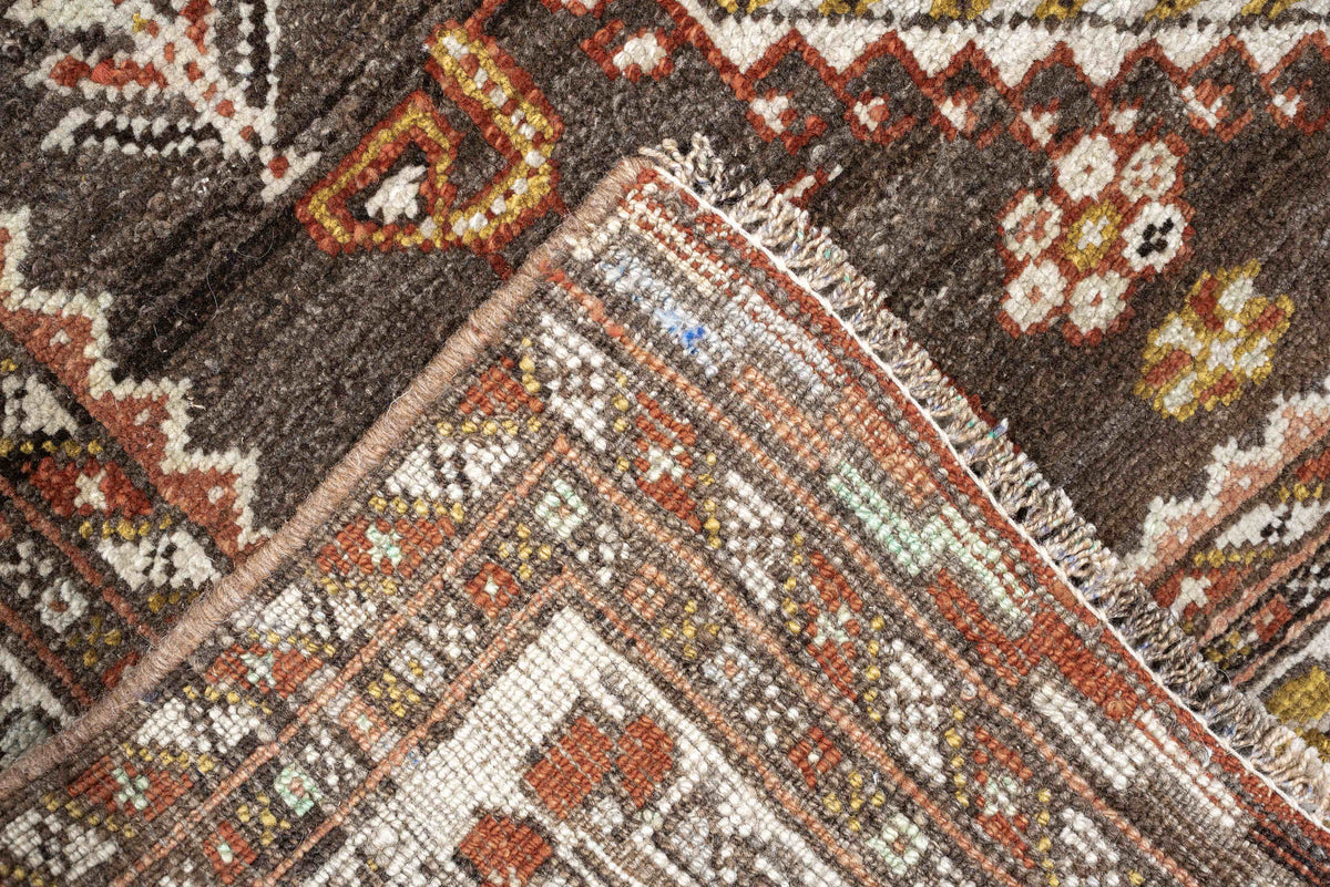 3' x 12' one-of-a-kind handmade antique Shiraz runner rug. Color palette: dark brown, ivory, rust, terra cotta, charcoal