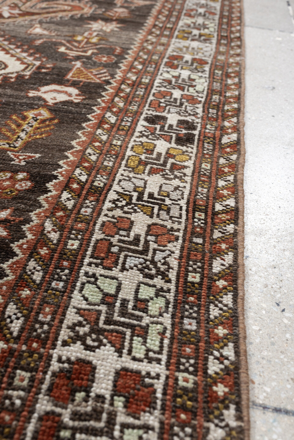 3' x 12' one-of-a-kind handmade antique Shiraz runner rug. Color palette: dark brown, ivory, rust, terra cotta, charcoal