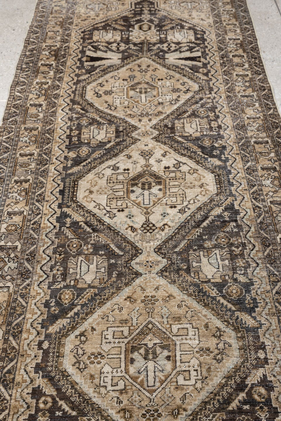 3' x 9' one-of-a-kind handmade antique Afshar runner rug. Color palette: ivory, charcoal, taupe, brown, camel, slate, ebony