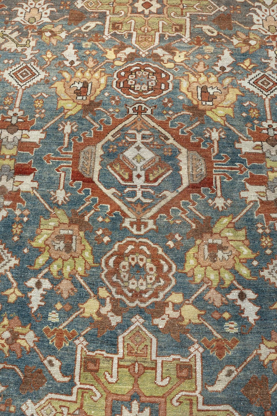11' x 13' one-of-a-kind handmade antique Karaje oversize rug. Color palette: teal blue, rust, ivory, terracotta, sage