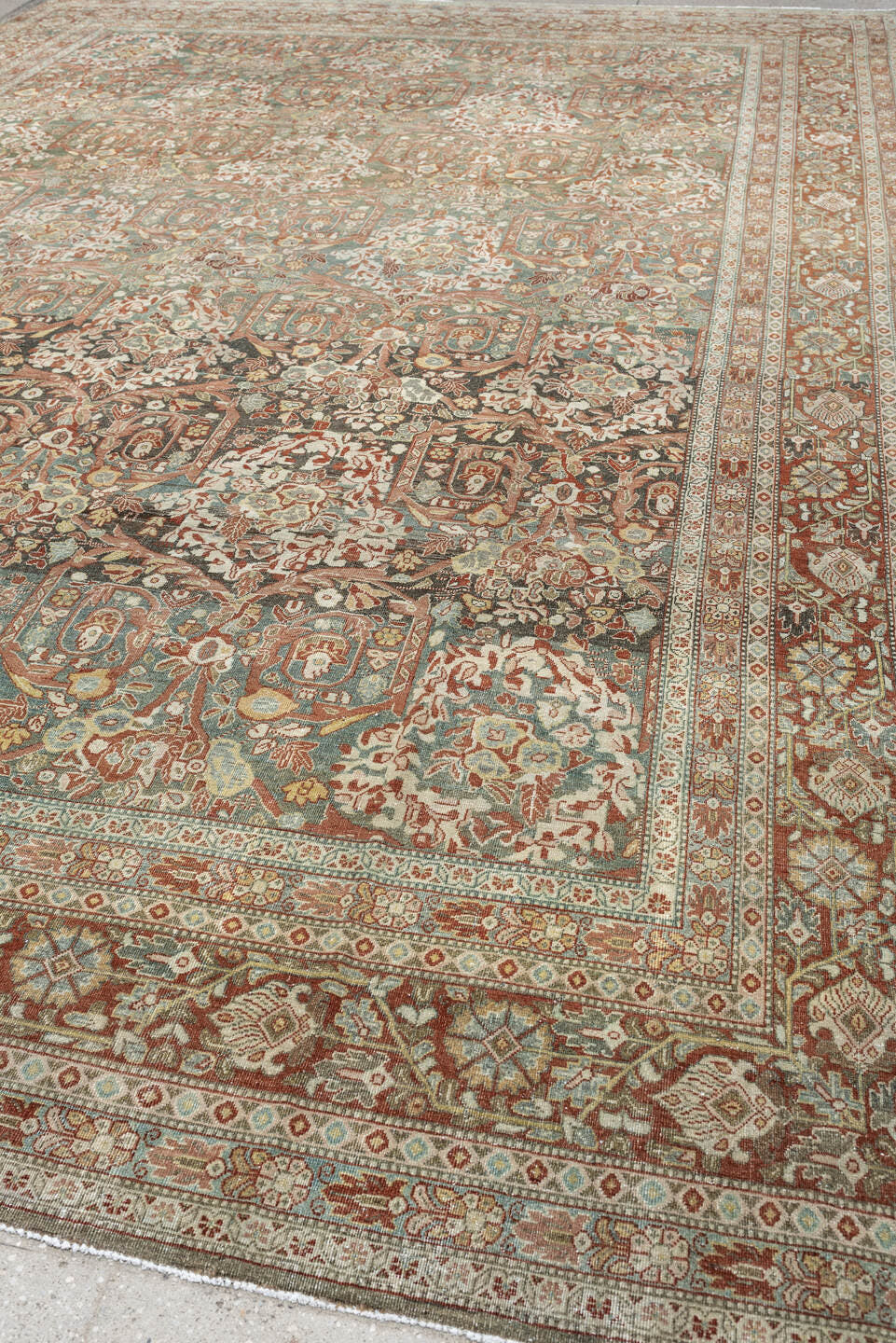 10' x 15' one-of-a-kind handmade antique Tabriz rug. Color palette: sage, ivory, terracotta, charcoal, taupe, coral