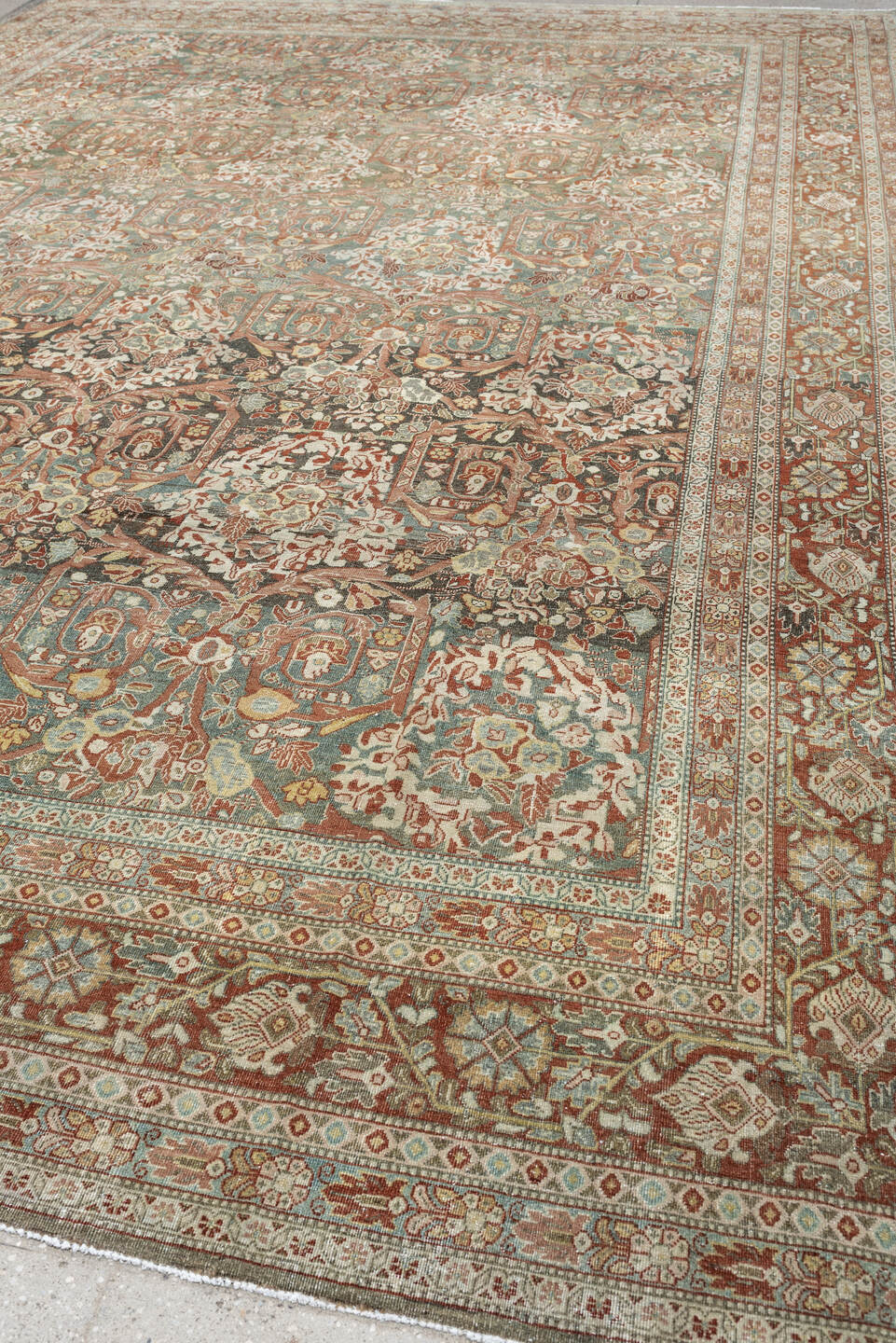 10' x 15' one-of-a-kind handmade antique Tabriz rug. Color palette: sage, ivory, terracotta, charcoal, taupe, coral