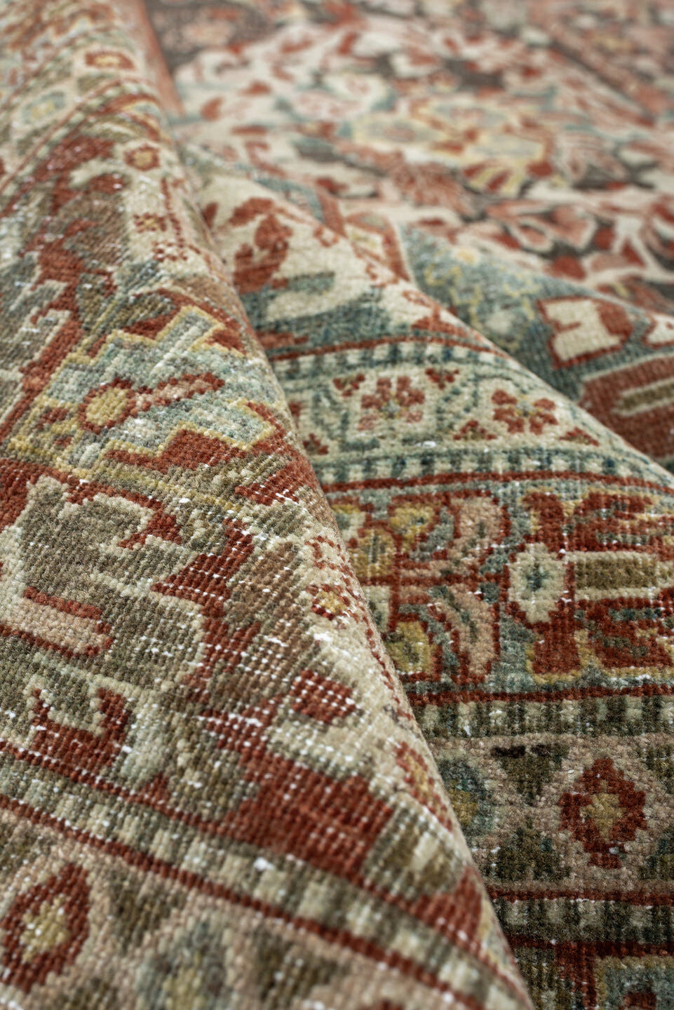 10' x 15' one-of-a-kind handmade antique Tabriz rug. Color palette: sage, ivory, terracotta, charcoal, taupe, coral