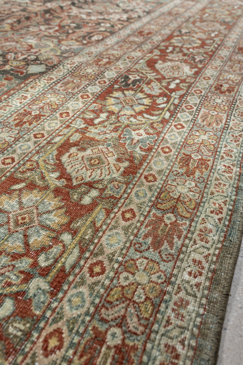10' x 15' one-of-a-kind handmade antique Tabriz rug. Color palette: sage, ivory, terracotta, charcoal, taupe, coral