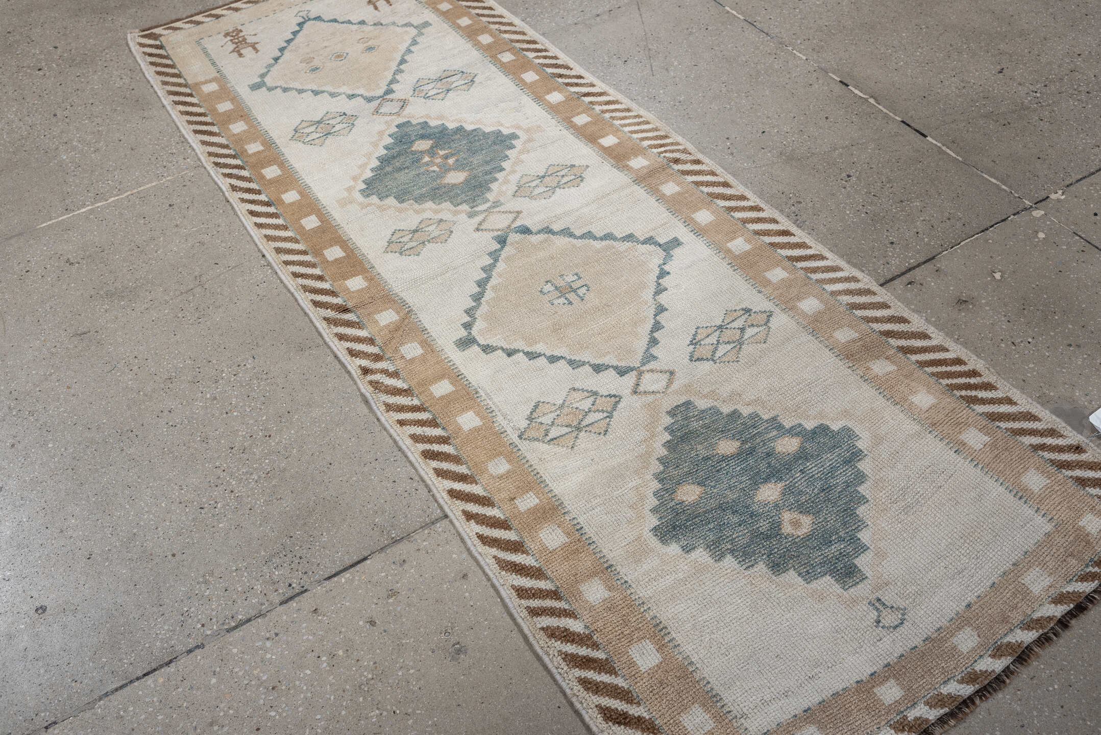 2' x 6' one-of-a-kind handmade antique Gabbe runner rug. Color palette: ivory, pale blue, camel, taupe, beige, light blue