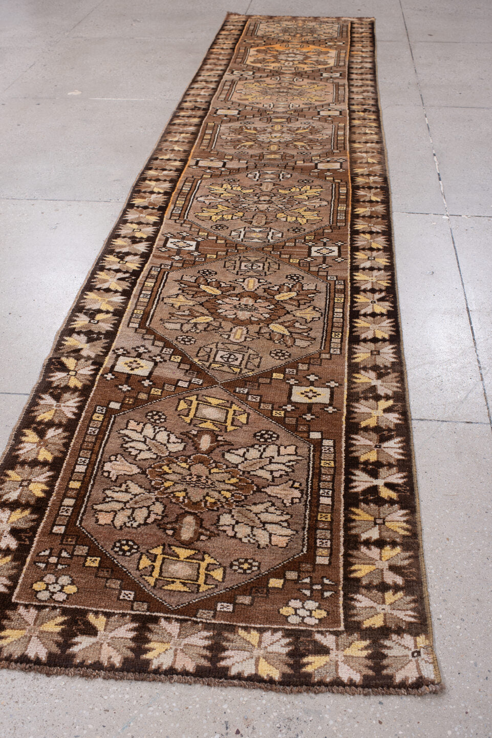 2' x 13' one-of-a-kind handmade antique Anatolian runner rug. Color palette: camel, brown, ivory, saffron, taupe, rose