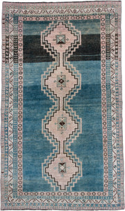 4' x 7' one-of-a-kind handmade antique Shiraz rug. Color palette: teal blue, ivory, blush, charcoal, slate blue, dark brown