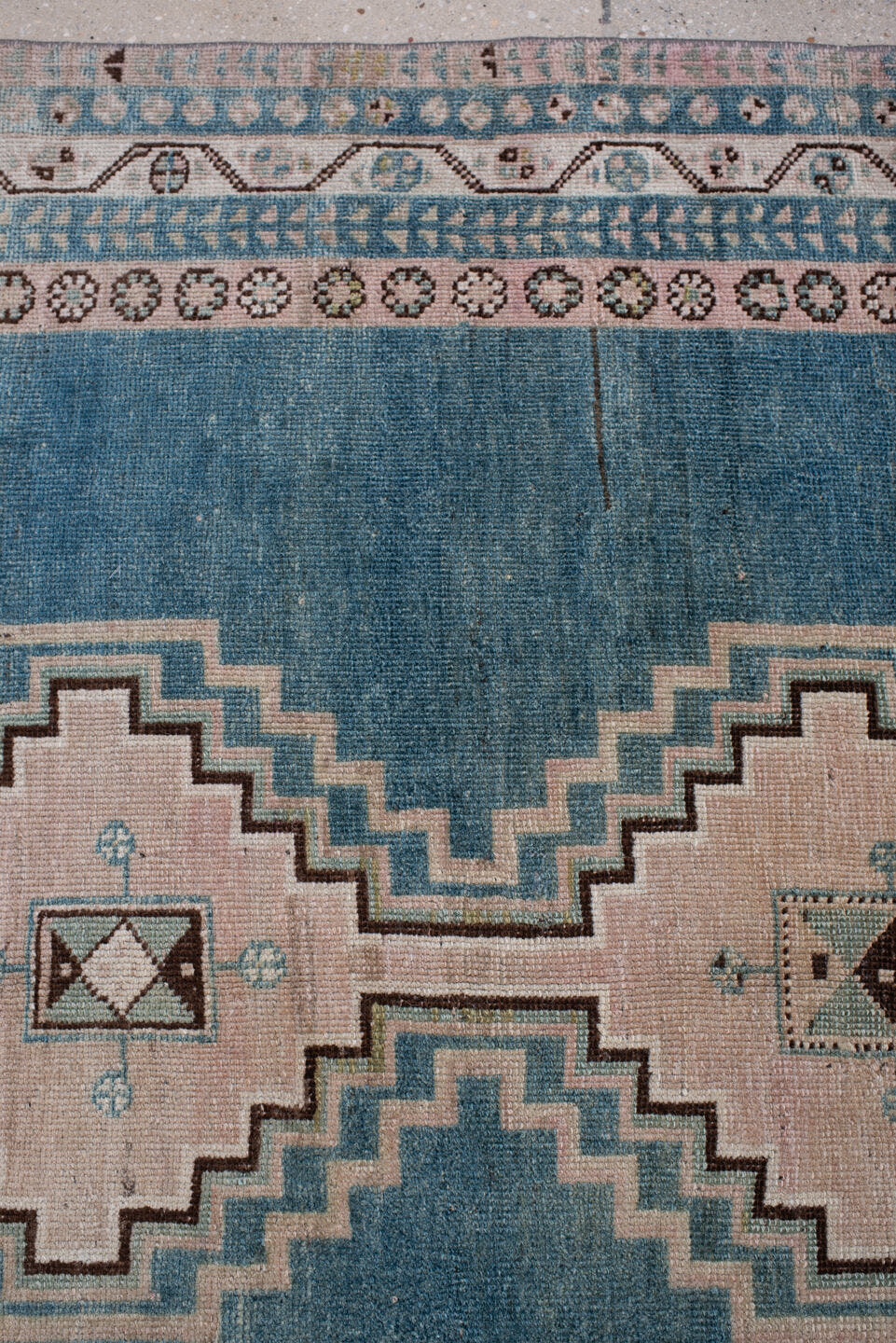 4' x 7' one-of-a-kind handmade antique Shiraz rug. Color palette: teal blue, ivory, blush, charcoal, slate blue, dark brown