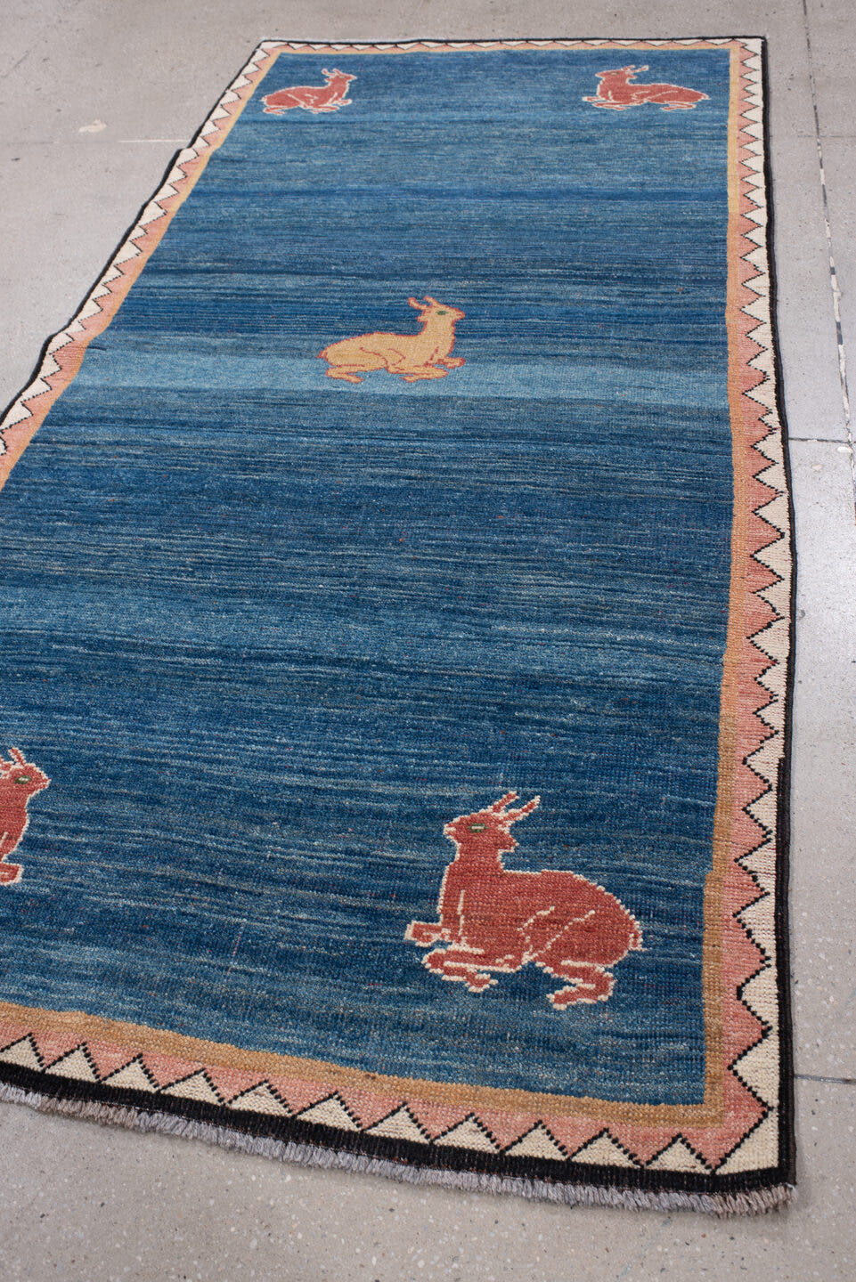 3' x 8' one-of-a-kind handmade antique Gabbe runner rug. Color palette: indigo, rust, ivory, blush, camel, charcoal, purple