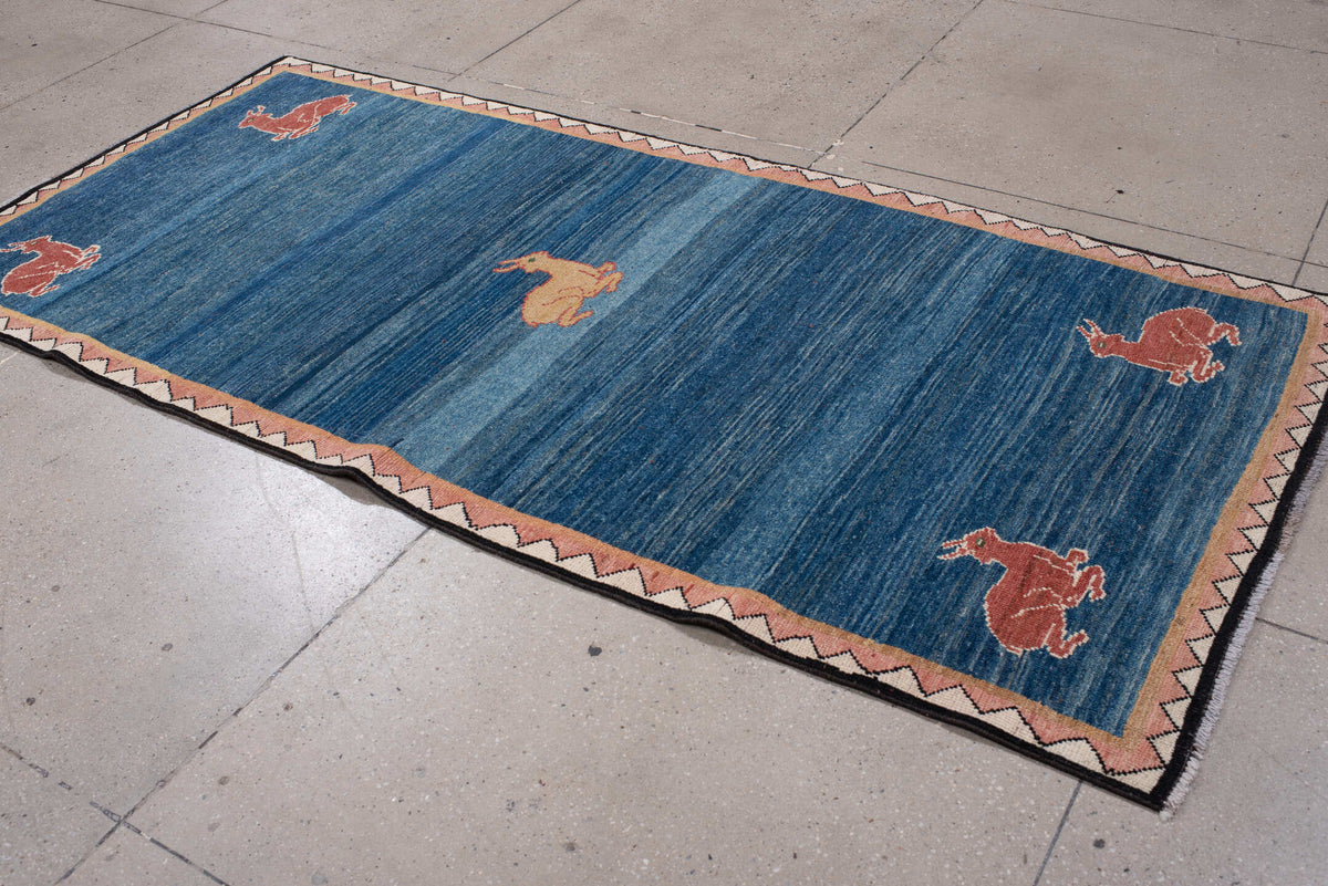 3' x 8' one-of-a-kind handmade antique Gabbe runner rug. Color palette: indigo, rust, ivory, blush, camel, charcoal, purple