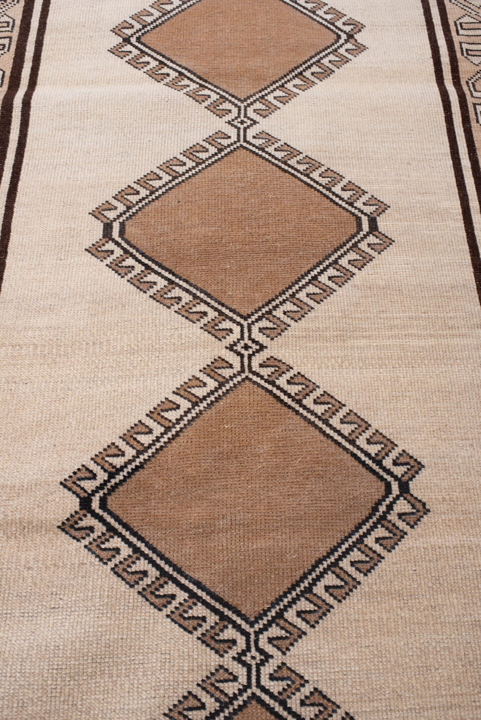 3' x 6' one-of-a-kind handmade antique Anatolian rug. Color palette: ivory, camel, dark brown, taupe, charcoal, beige, brown