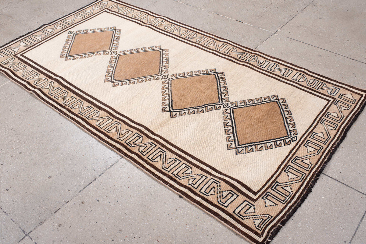 3' x 6' one-of-a-kind handmade antique Anatolian rug. Color palette: ivory, camel, dark brown, taupe, charcoal, beige, brown