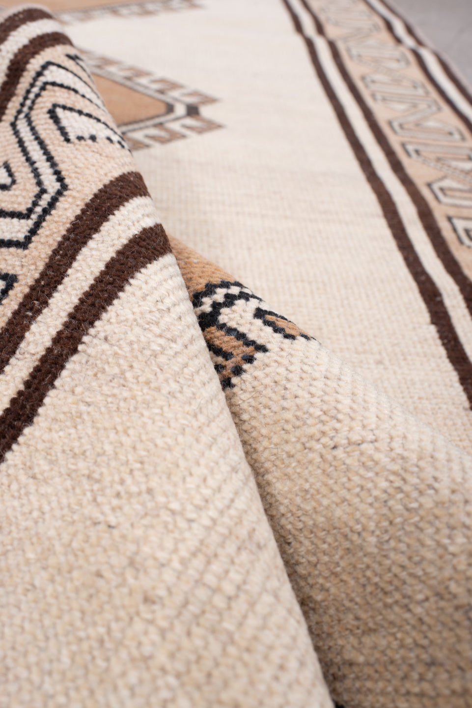 3' x 6' one-of-a-kind handmade antique Anatolian rug. Color palette: ivory, camel, dark brown, taupe, charcoal, beige, brown