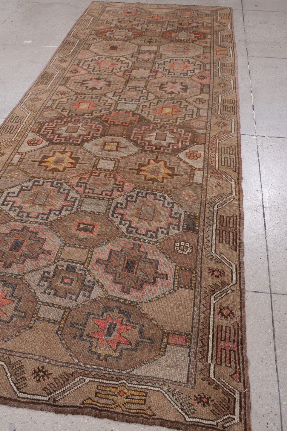 4' x 11' one-of-a-kind handmade antique Anatolian runner rug. Color palette: camel, taupe, rose, rust, charcoal, ivory