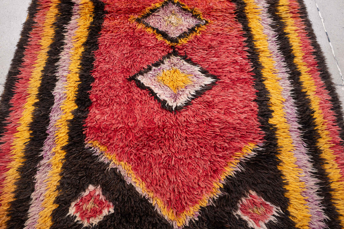 4' x 8' one-of-a-kind handmade antique Tulu rug. Color palette: crimson, dark brown, saffron, lavender, rose, coral, ivory