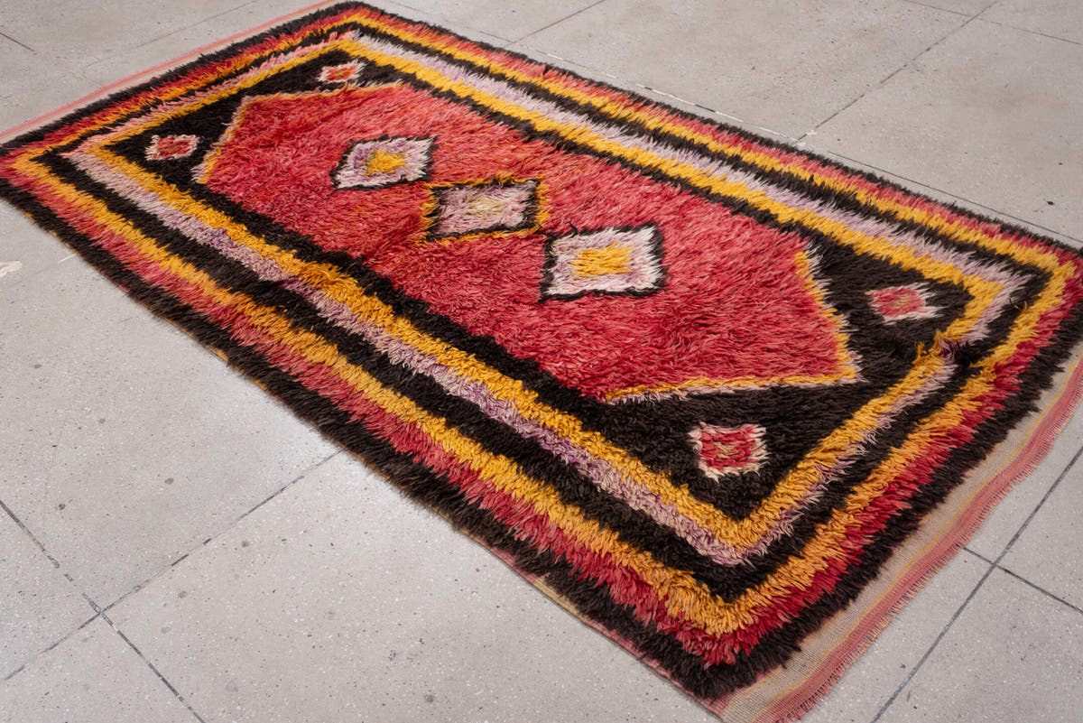 4' x 8' one-of-a-kind handmade antique Tulu rug. Color palette: crimson, dark brown, saffron, lavender, rose, coral, ivory