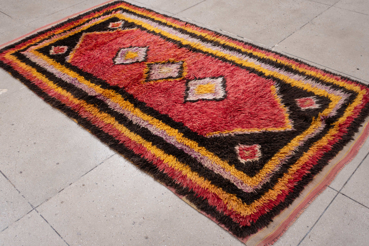 4' x 8' one-of-a-kind handmade antique Tulu rug. Color palette: crimson, dark brown, saffron, lavender, rose, coral, ivory