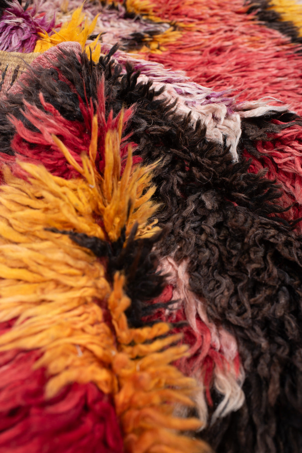 4' x 8' one-of-a-kind handmade antique Tulu rug. Color palette: crimson, dark brown, saffron, lavender, rose, coral, ivory