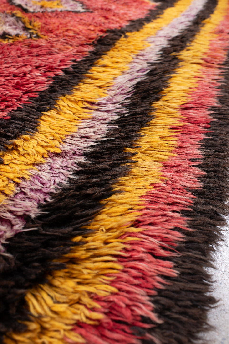 4' x 8' one-of-a-kind handmade antique Tulu rug. Color palette: crimson, dark brown, saffron, lavender, rose, coral, ivory