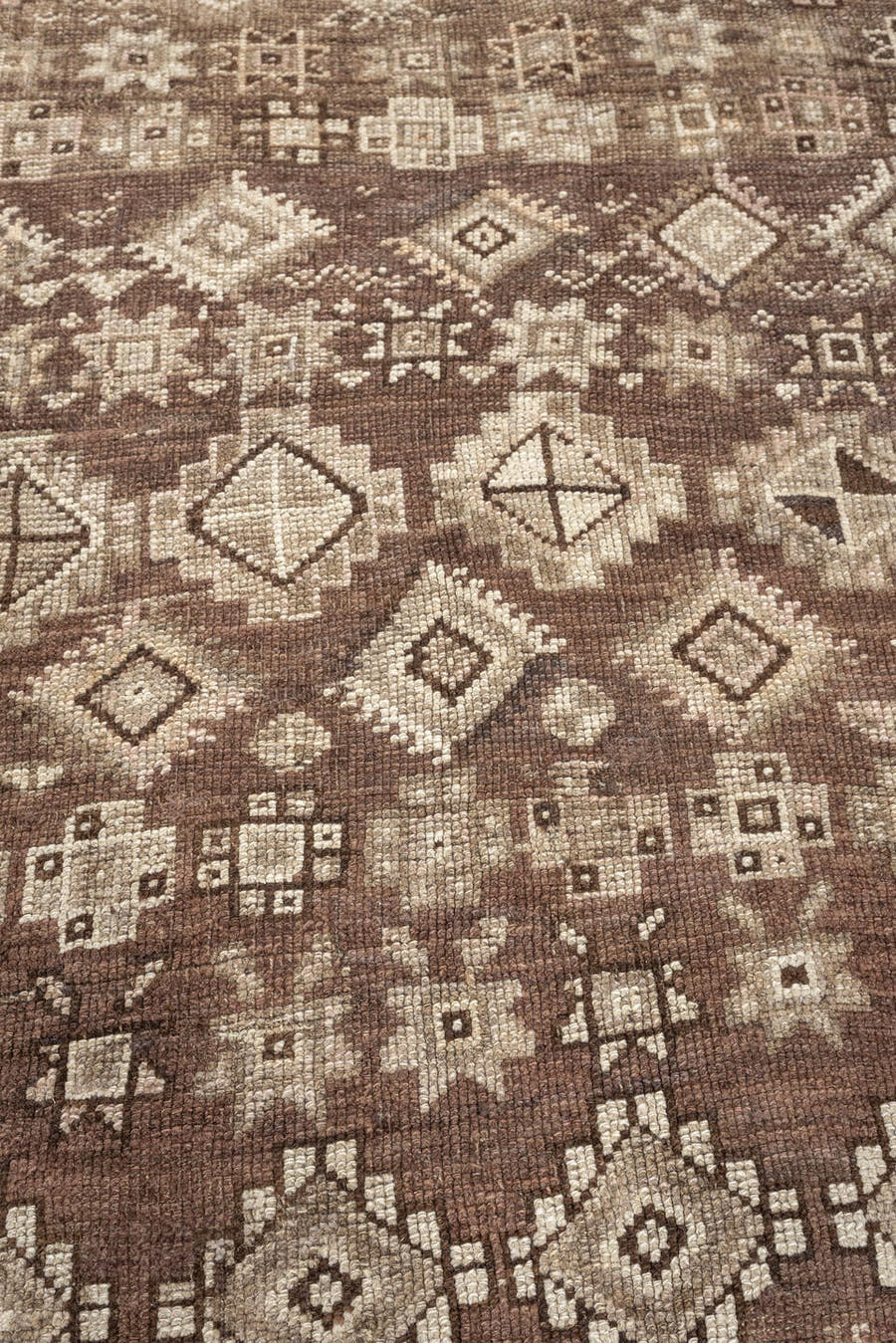 4' x 11' one-of-a-kind handmade antique Kars runner rug. Color palette: brown, ivory, taupe, charcoal, beige, camel, gray