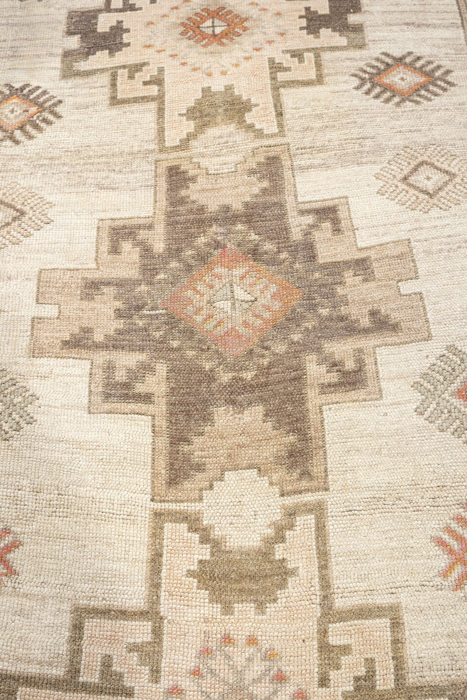 4' x 10' one-of-a-kind handmade antique Anatolian runner rug. Color palette: ivory, taupe, charcoal, camel, coral, rose