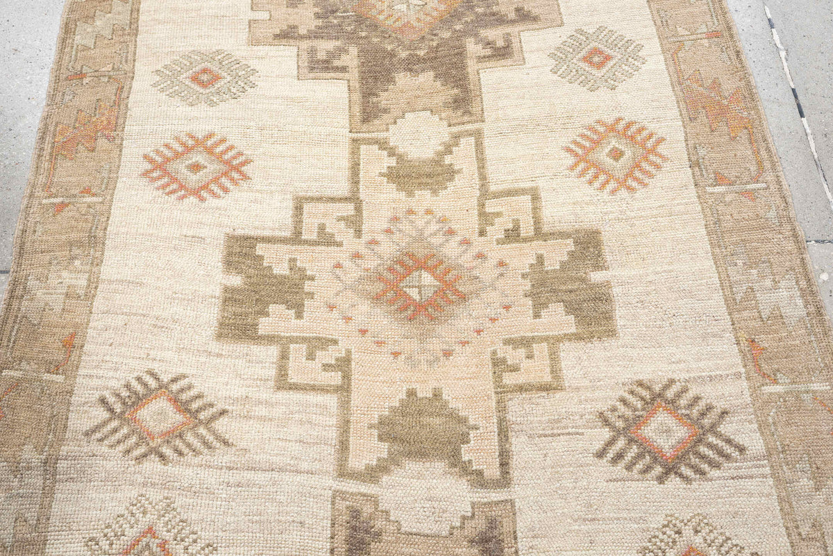 4' x 10' one-of-a-kind handmade antique Anatolian runner rug. Color palette: ivory, taupe, charcoal, camel, coral, rose