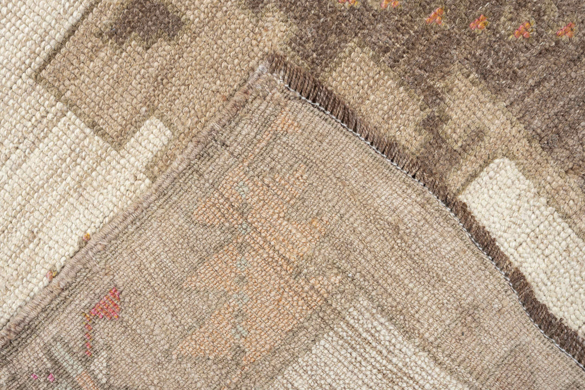 4' x 10' one-of-a-kind handmade antique Anatolian runner rug. Color palette: ivory, taupe, charcoal, camel, coral, rose