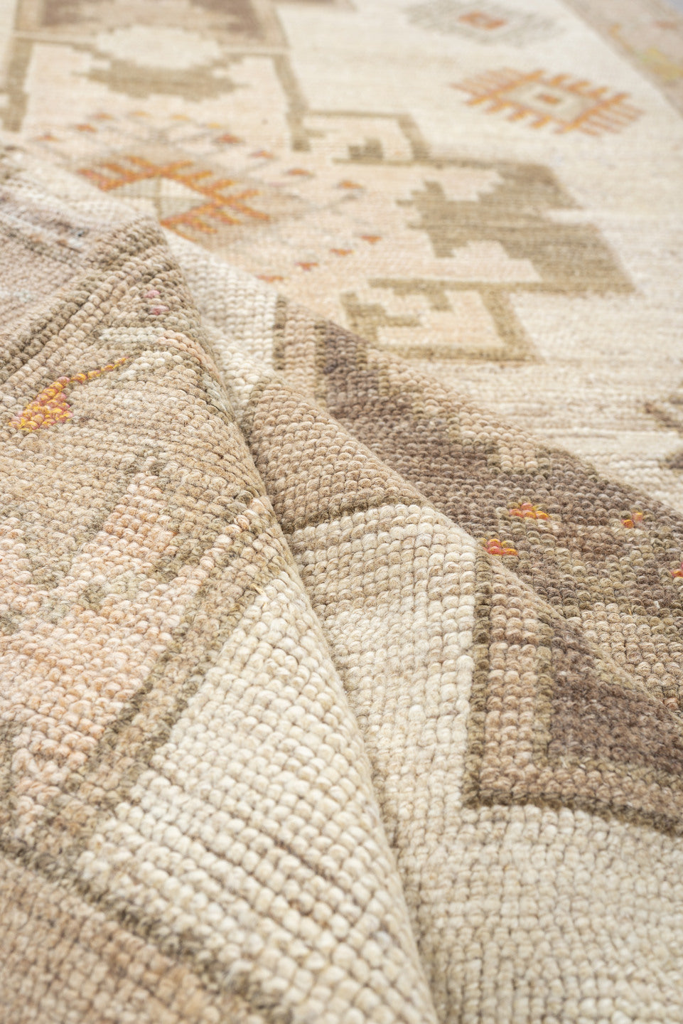 4' x 10' one-of-a-kind handmade antique Anatolian runner rug. Color palette: ivory, taupe, charcoal, camel, coral, rose