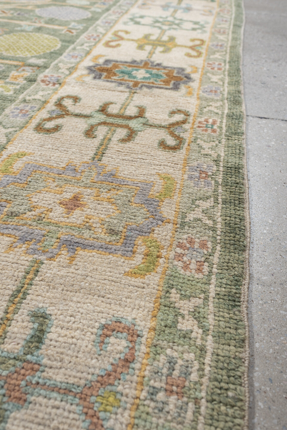 8' x 10' one-of-a-kind handmade antique Oushak large size rug. Color palette: sage, ivory, coral, gold, pale blue, charcoal