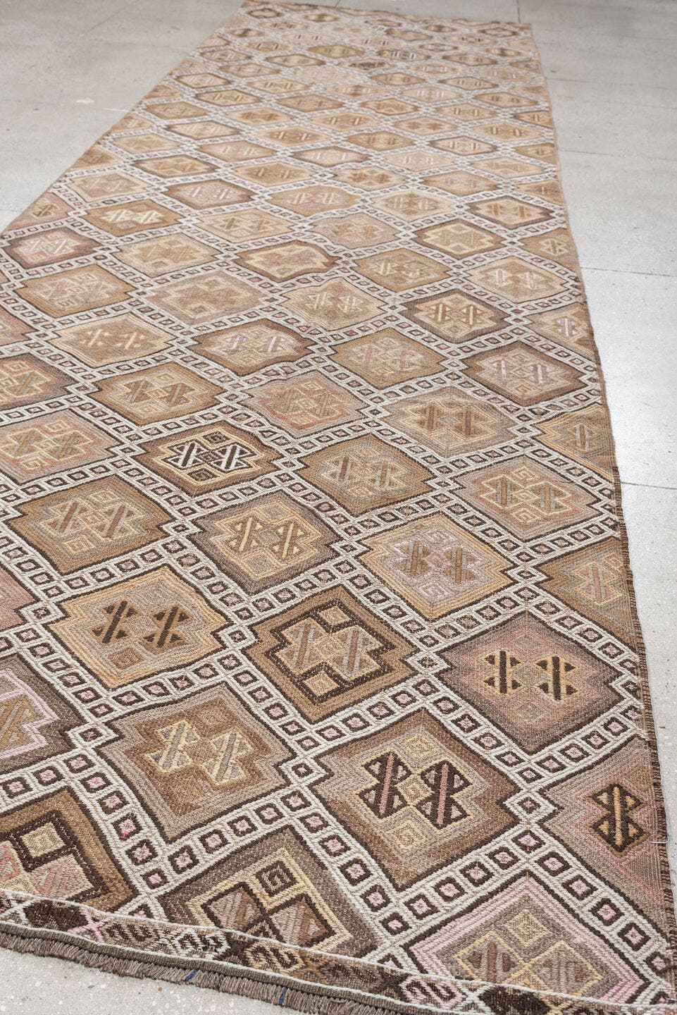 4' x 16' one-of-a-kind handmade antique Jijim runner rug. Color palette: ivory, taupe, camel, dusty rose, brown, charcoal